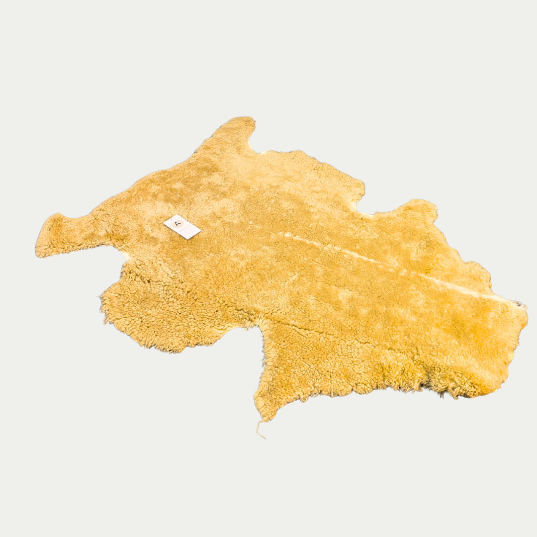 brown pet sheepskin rug on white backround