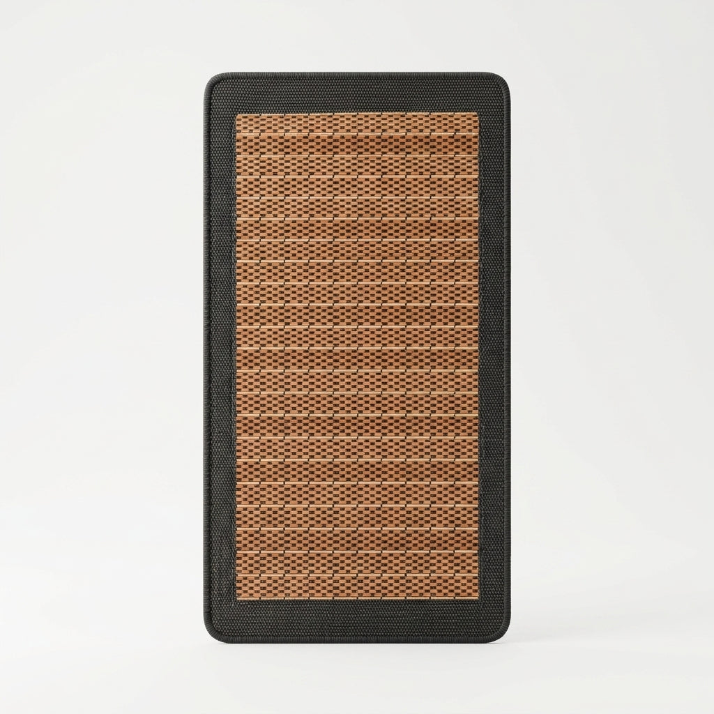 Rectangular mat with brown woven pattern and black border on a white background