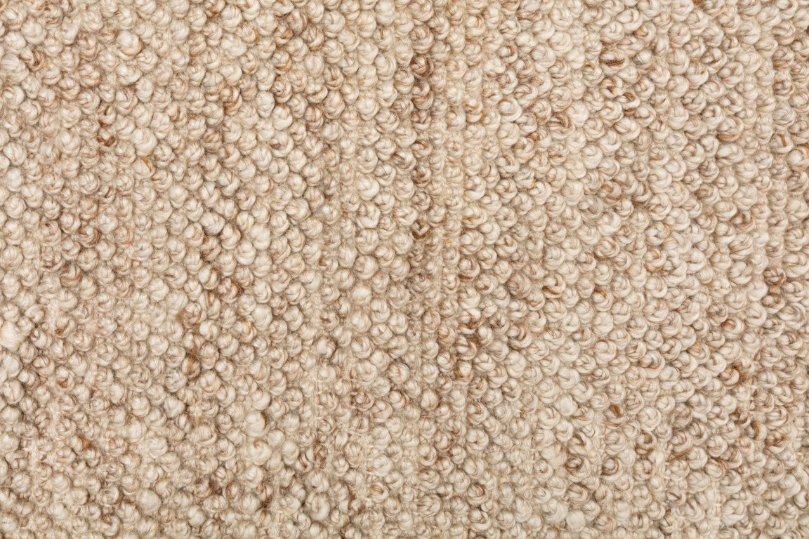 Handwoven Avenue Rug in Beige, highlighting its luxurious and eco-friendly design, perfect for adding a warm touch to modern interiors.