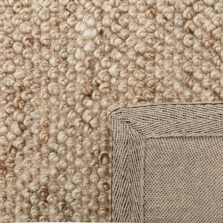 Close-up of the Avenue Beige Rug, emphasizing its plush pile and intricate weaving, reflecting superior craftsmanship and quality.