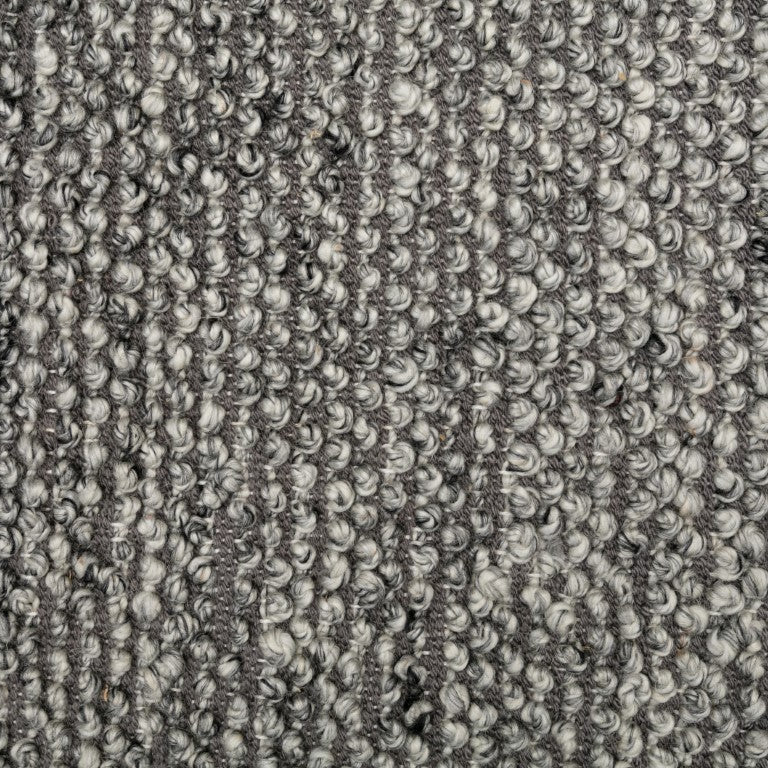 Close-up of the Avenue Rug in Shale, highlighting its wool-like texture and soft feel, handwoven in India, perfect for adding a touch of sophistication to any room.