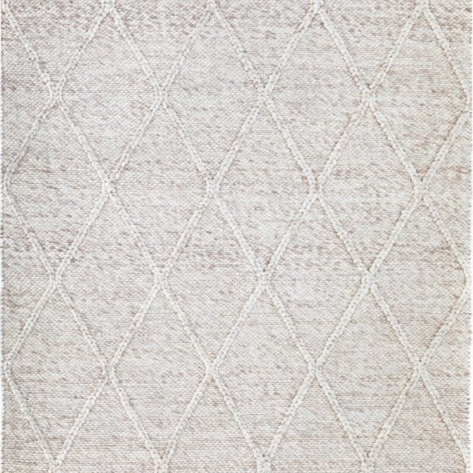 Beige Colombo rug with braided diamond pattern, hand-woven from New Zealand wool, showcasing intricate craftsmanship and a luxurious, plush texture available at Noosa Rugs.