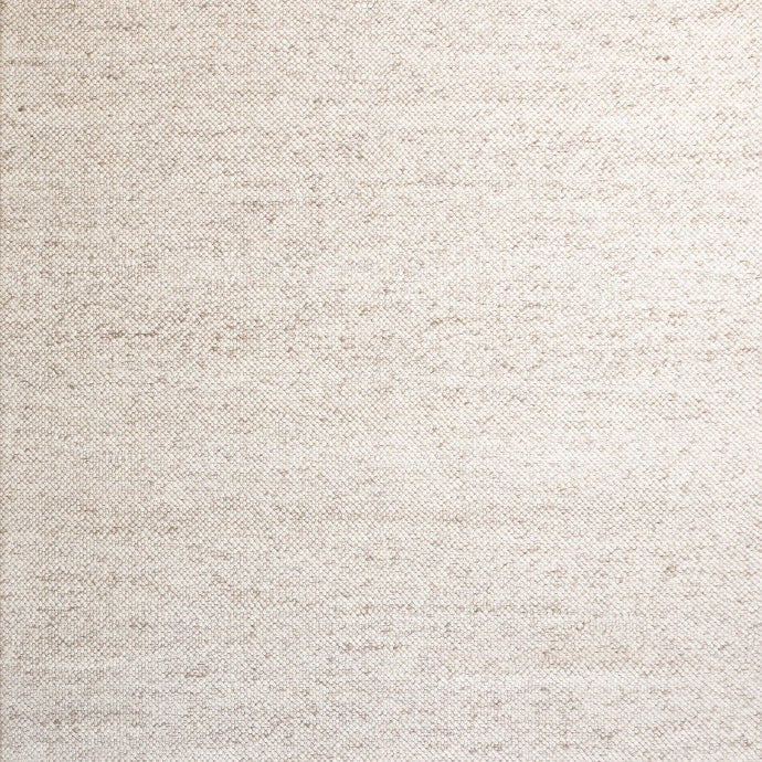 Elegant LUNAR Rug in Almond, showcasing its luxurious 100% wool texture and warm, neutral color, perfect for enhancing the coziness of any living space.