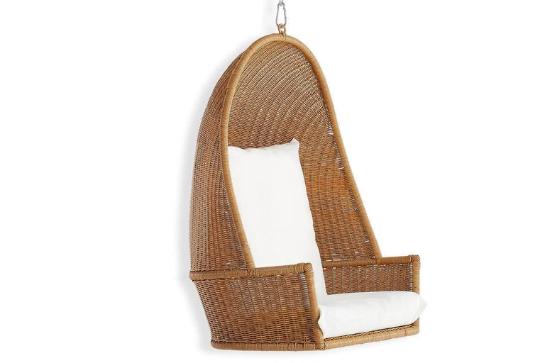 Wicker hanging chair with white cushion on a white background