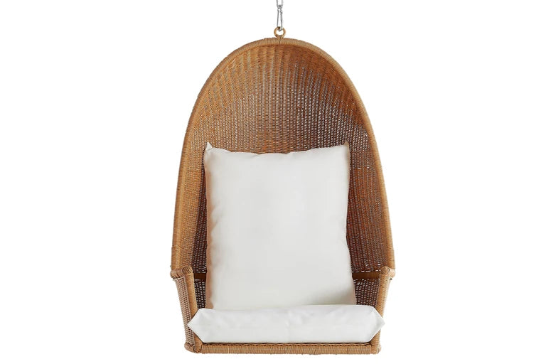 Wicker hanging chair with a white cushion on a white background