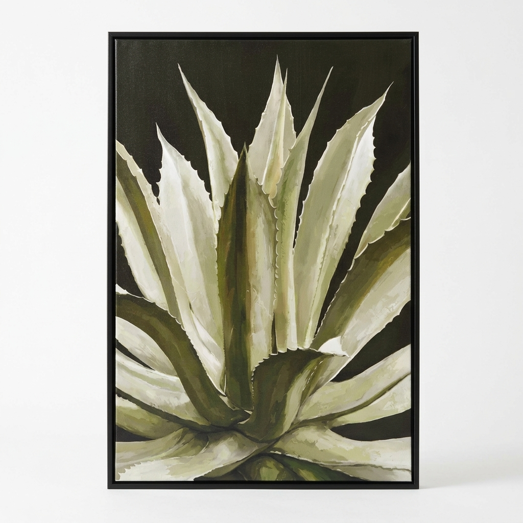 A framed botanical art print of an agave plant, featuring textured cream and olive green leaves against a dark background, enclosed in a thin black frame.