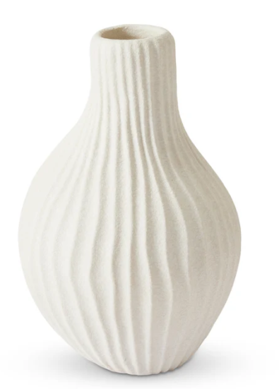 An off-white ceramic vase with a textured, vertically ribbed design and a flared rim, shown on a plain white background.
