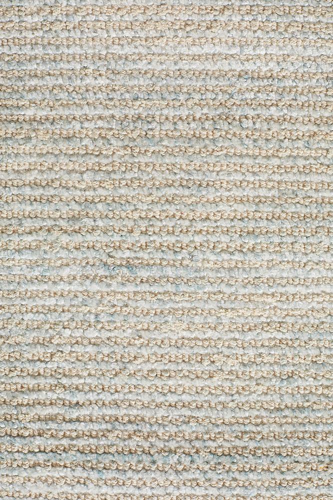 Detailed close-up of the Allure Rug in Sky, highlighting the intricate texture from its rayon-cotton blend and the luxurious 9mm cut loop pile.