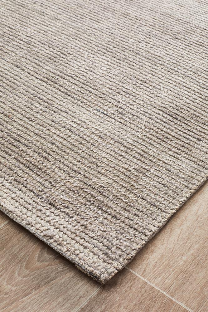 Detailed view of the Allure Rug's Stone coloured texture, emphasizing the luxurious feel of the rayon-cotton blend and the quality of its 9mm pile.