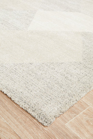 Focused image on the edge of the Alpine Rug, showcasing the precision of its power-loomed construction.