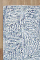 Astrid Hexagon Blue Rug on timber flooring