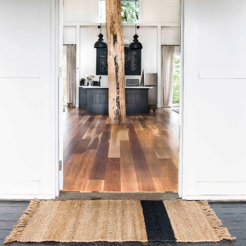 Wooden floor with a jute rug in a modern interior setting