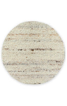Round woven rug with striped pattern on a white background
