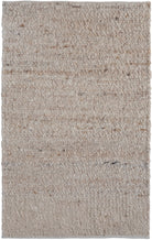 Textured beige rug with a subtle pattern on a plain background