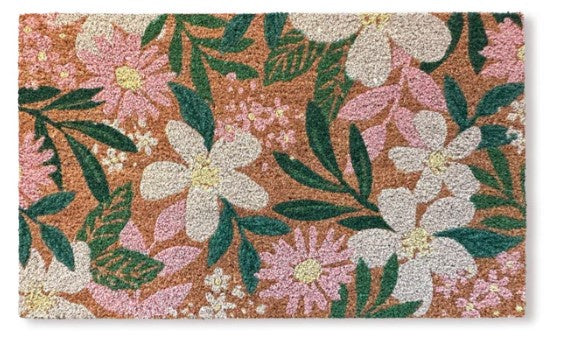 Floral patterned doormat with flowers and leaves on a brown background