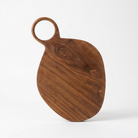 A teardrop-shaped wooden cutting board with a loop handle, made from medium brown wood with visible grain patterns, photographed on a clean white background.