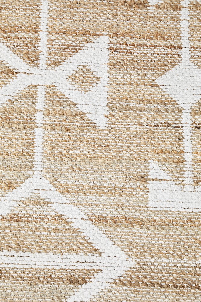 Zoomed-in view showing the flat woven cotton and jute pile of the Bodhi - Trudy Rug, emphasizing its sleek and contemporary design.