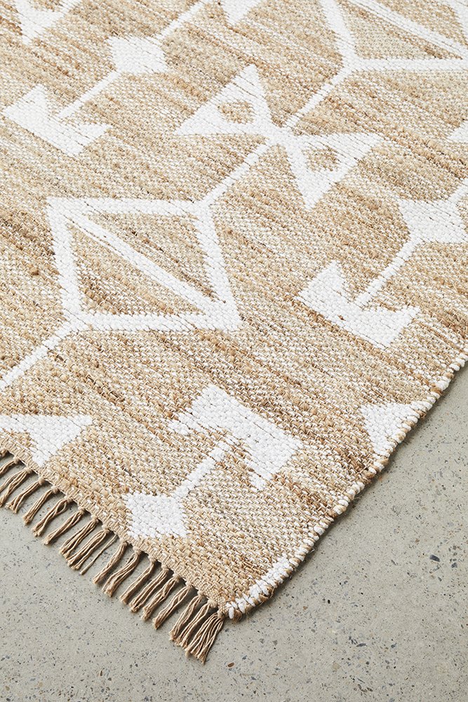 Detailed close-up of the Bodhi - Trudy Rug's triangle motifs, highlighting the intricate hand-loomed patterns and natural texture.