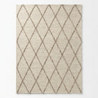 Beige area rug with diamond pattern on a light gray background