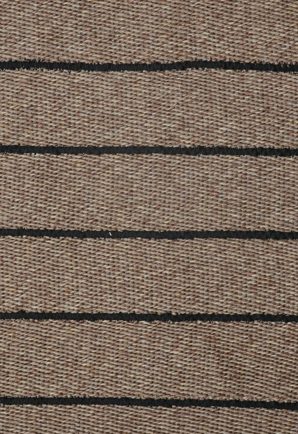 Close-up of brown fabric with black horizontal lines