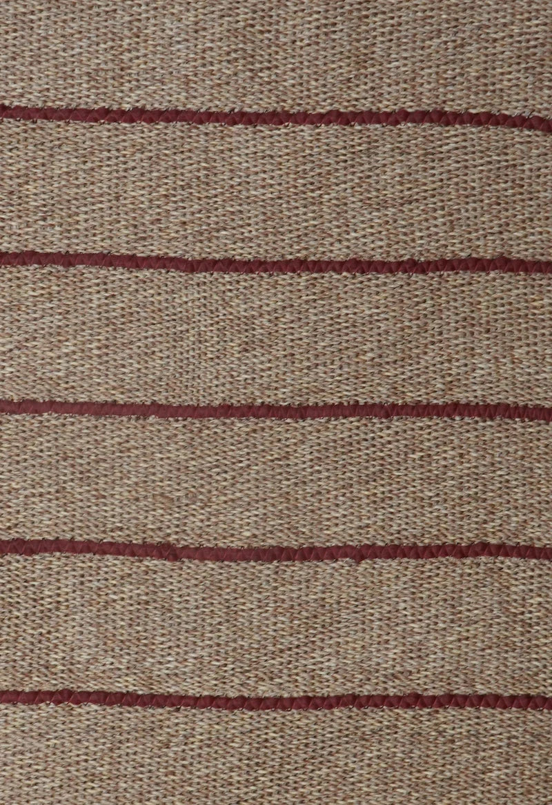 Close-up of fabric with brown stripes on a beige background
