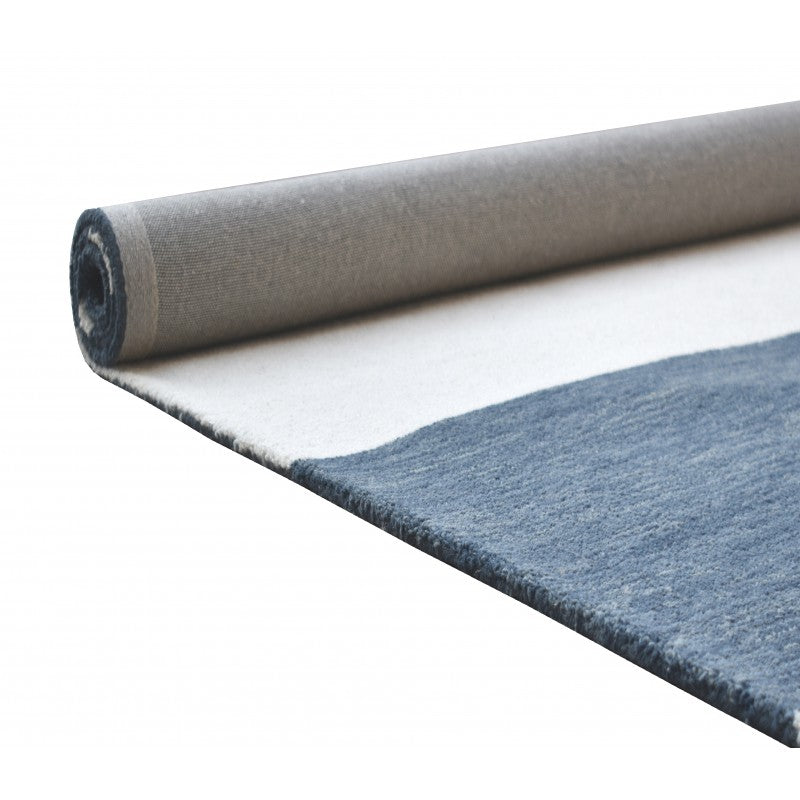 Roll of blue carpet on a white background