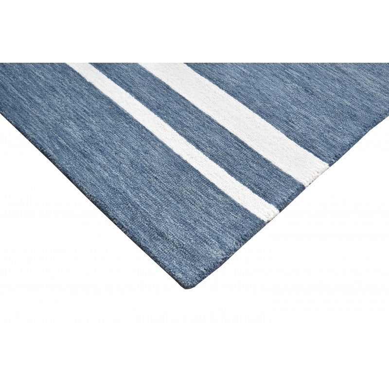 Blue and white striped rug on a white background
