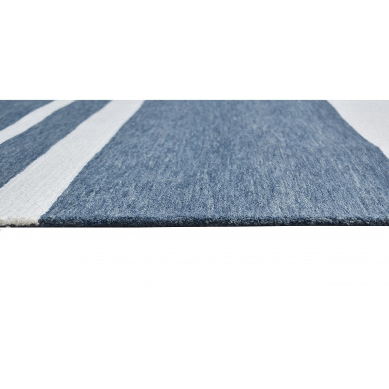 Close-up of a blue and white striped rug on a white background