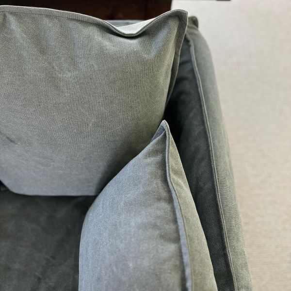 Close-up of gray pillows on a sofa