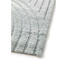 Close-up of a textured gray rug on a white background
