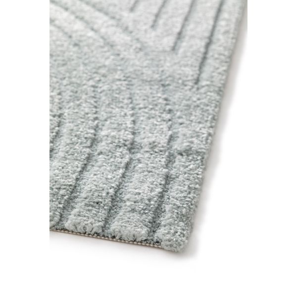 Close-up of a textured gray rug on a white background