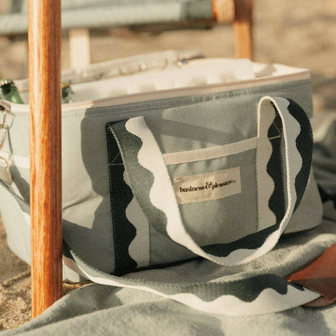 Camouflage-patterned bag with a visible brand logo on a blurred background