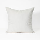 A square throw pillow in a light gray ribbed corduroy fabric, shown against a plain white background.