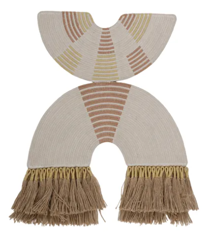 A pair of cream-colored woven baby footmuffs with fringe, featuring geometric patterns in tan, brown, and muted yellow.
