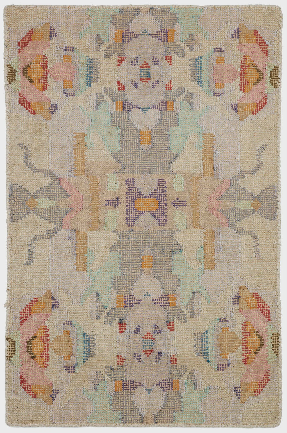 Decorative rug with a central figure and floral patterns on a beige background