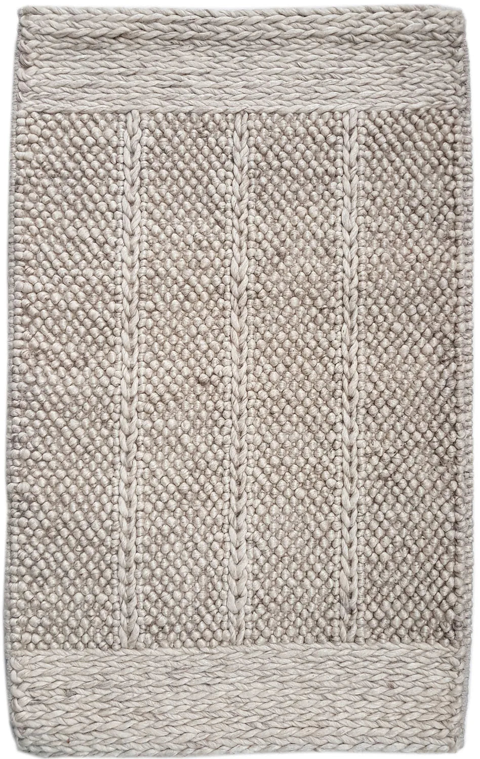 Textured beige bath mat with a woven pattern
