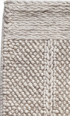 Crossover Sand rug with a white background