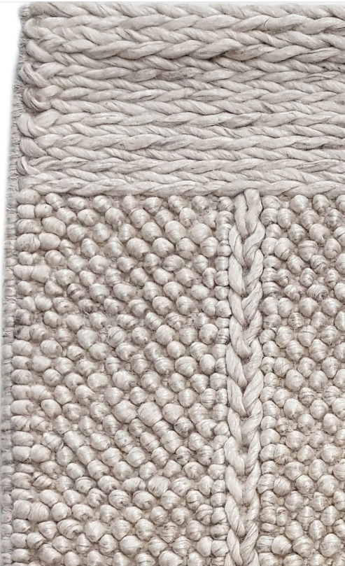 Crossover Sand rug with a white background