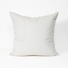 A square throw pillow in a light gray ribbed corduroy fabric, shown against a plain white background.