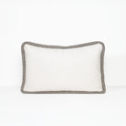 A rectangular lumbar pillow with a solid white center and a textured gray bouclé border, shown against a plain white background.