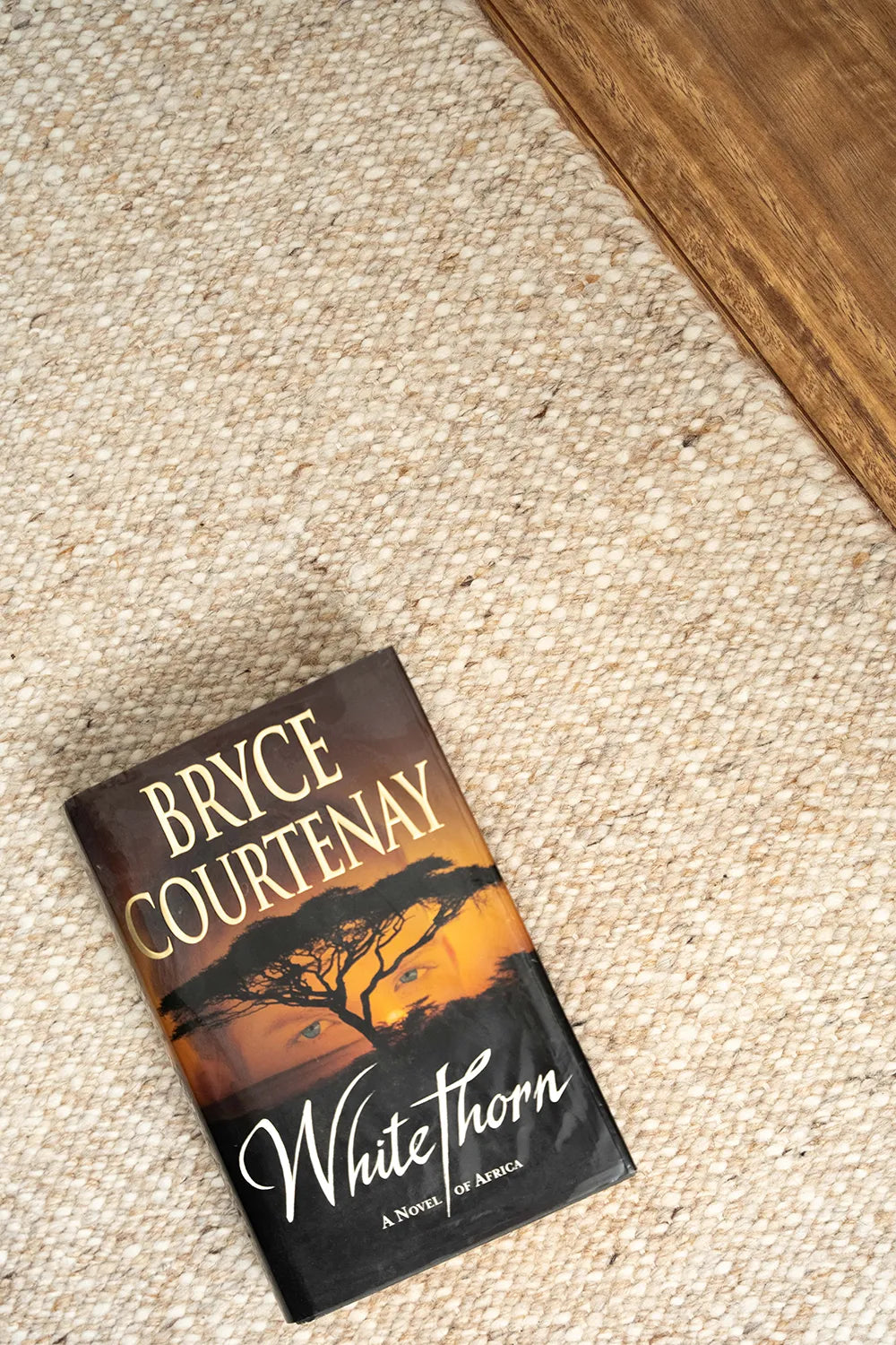 Wool rug with a book sitting on it