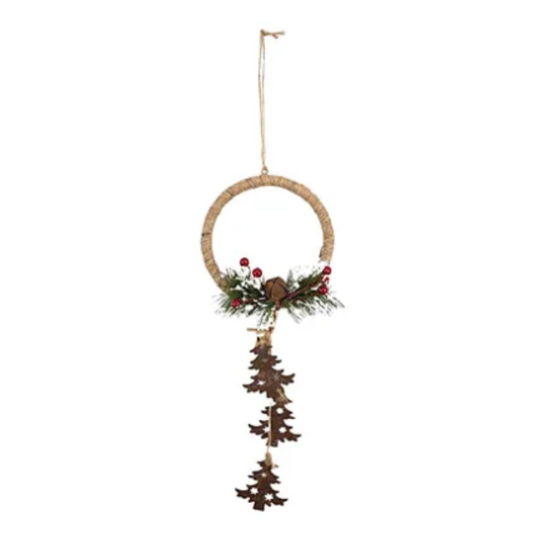 A rustic hanging Christmas ornament featuring a natural jute ring decorated with green pine garland, red berries, and a hanging string of small brown wooden Christmas trees, suspended by a jute string on a white background.