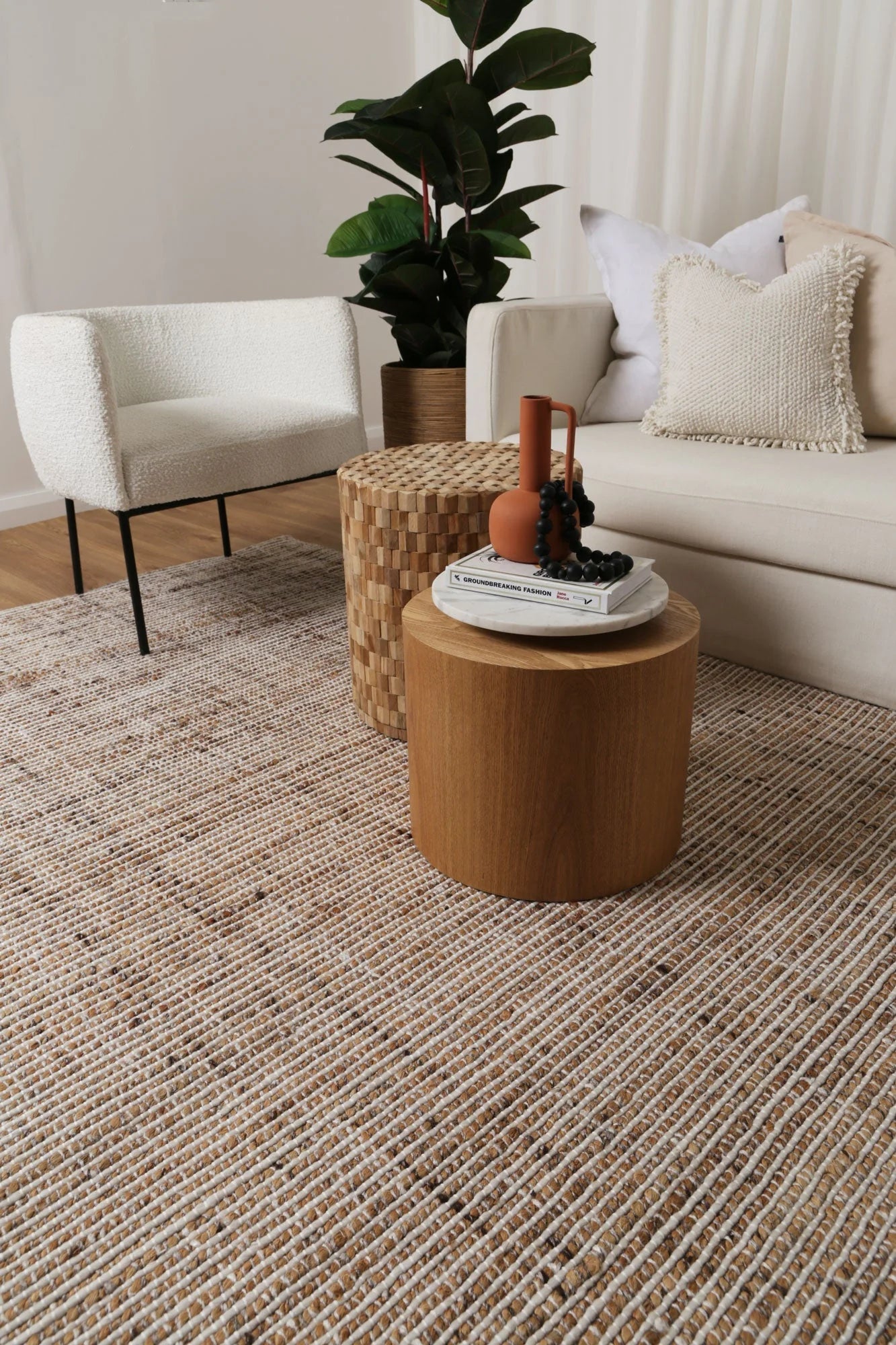 Dune Ivory Rug displayed in a room with neutral decor, accentuating its versatility and natural aesthetic.
