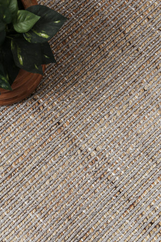 Zoomed-in view of the Dune Rug's hand-knotted weave, emphasizing the expert craftsmanship and quality.