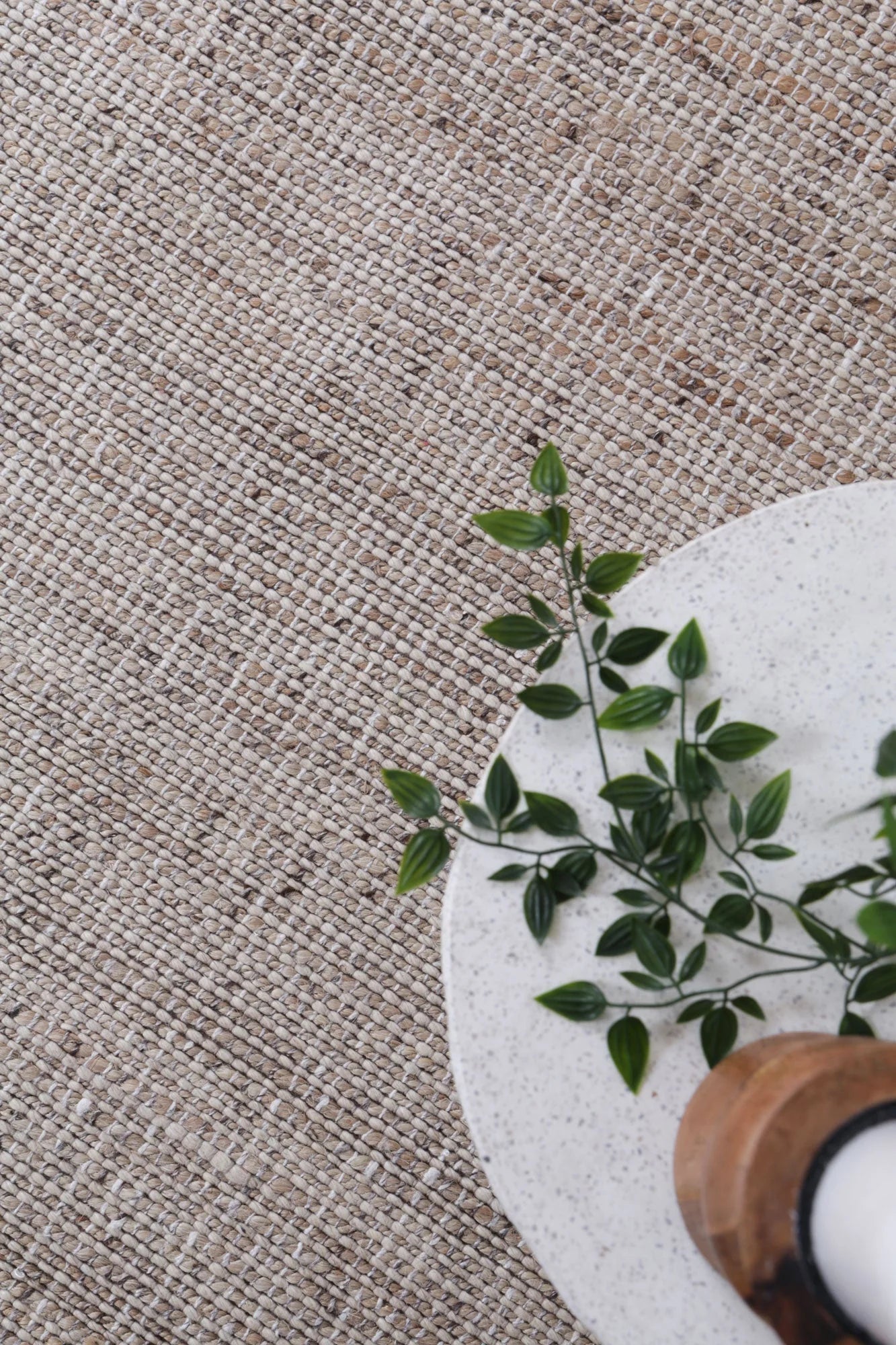 Detailed close-up of the Dune Rug's texture, highlighting the interwoven jute and wool fibers.