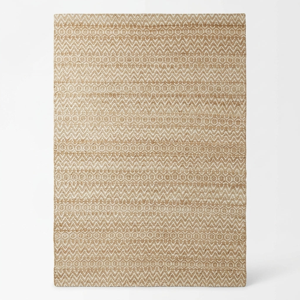 A rectangular area rug with a horizontal woven texture, featuring a repeating geometric pattern in warm beige and light brown tones, shown against a plain white background.