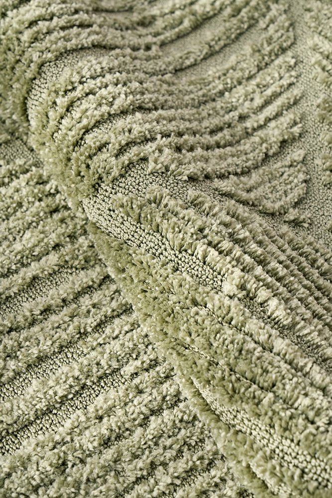Close-up of textured green fabric with wavy pattern