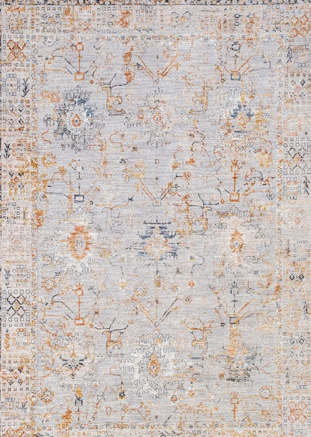 A distressed traditional area rug featuring a faded light gray base with intricate patterns in muted orange, beige, and soft blue.