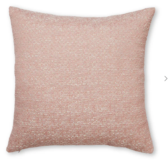 Pink textured pillow on a white background