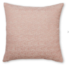 Pink textured pillow on a white background